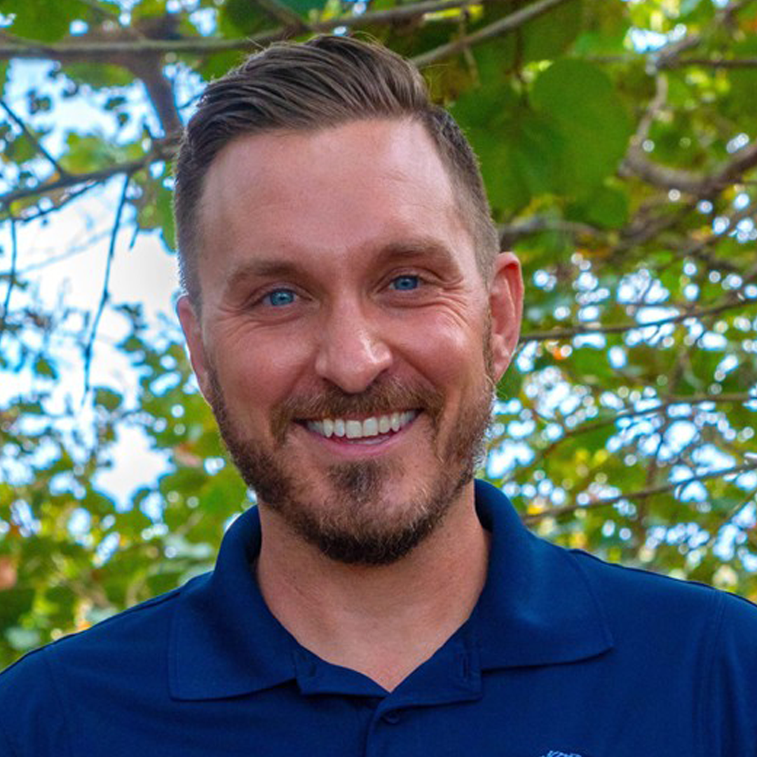 Dr. Justin R. Perrault, Vice President of Research at Loggerhead Marinelife Center. Smiling man with a blue polo shirt on.